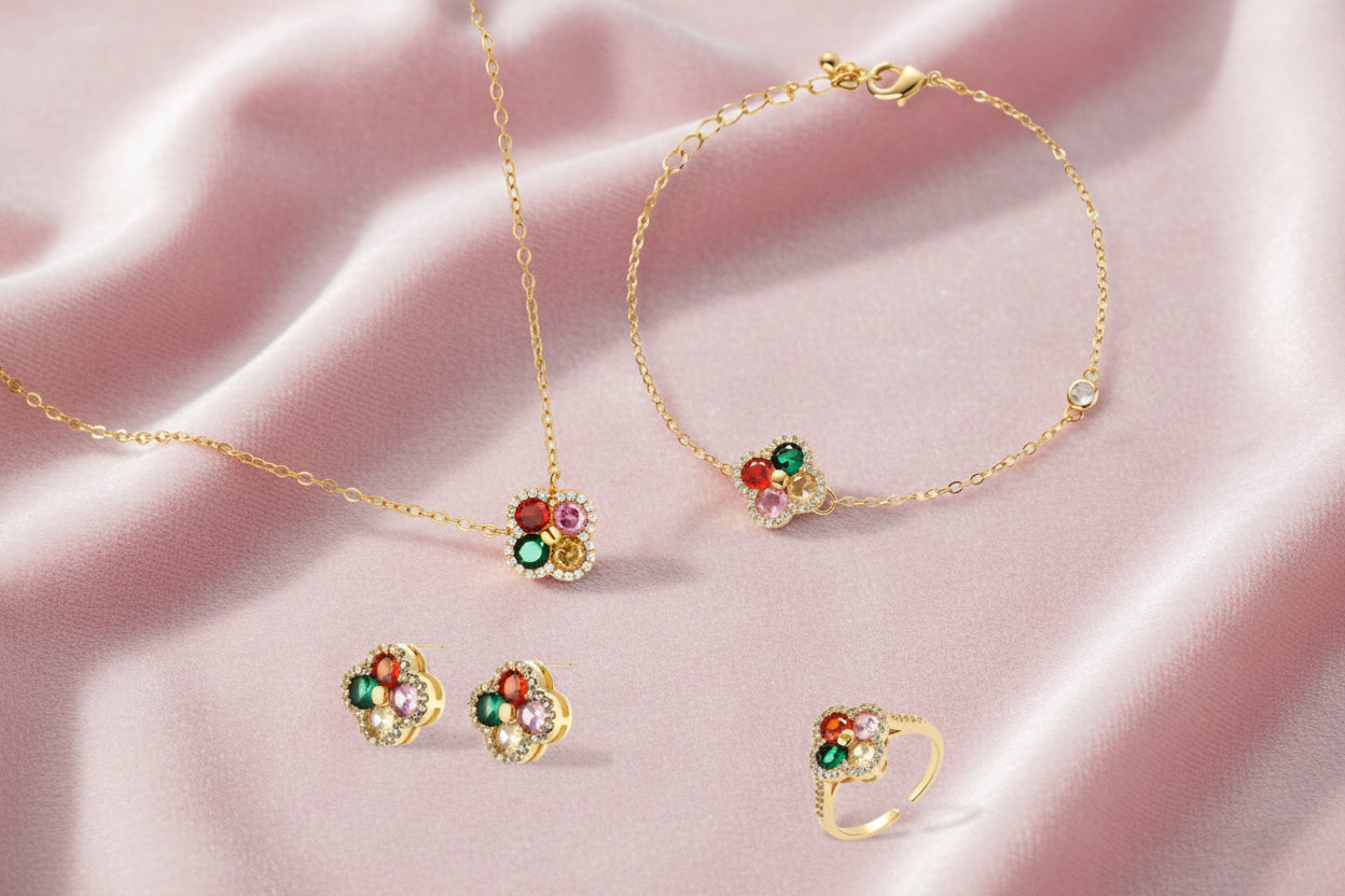 Gold-plated clover jewelry set with red, pink, green and champagne CZ stones surrounded by crystal borders