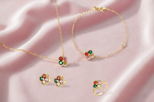 Gold-plated clover jewelry set with red, pink, green and champagne CZ stones surrounded by crystal borders