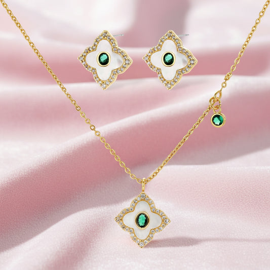 Gold-plated jewelry set with diamond-shaped pendants featuring white centers, green stones, and sparkling zirconia borders