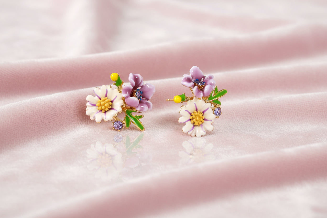 Cluster-style stud earrings with purple pansies, white daisies, yellow centers, and green leaves in glossy enamel finish