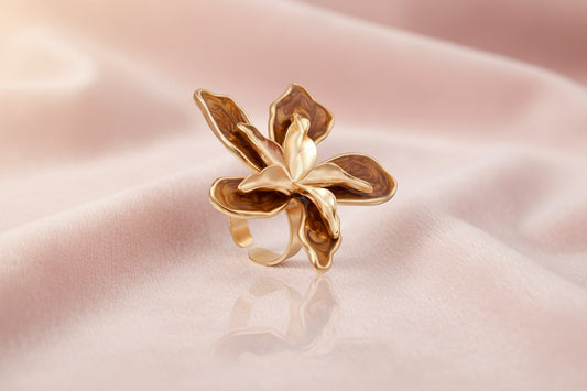 Large rose gold ring with marbled brown enamel petals in a sculptural flower design