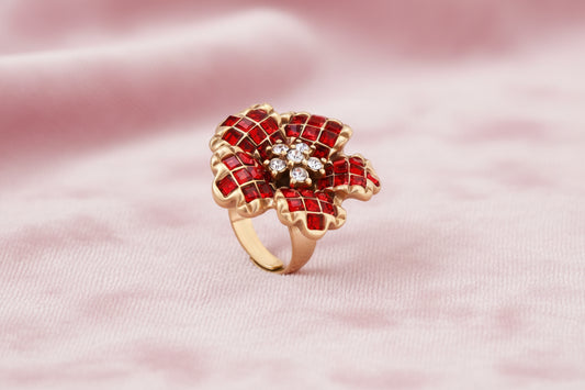 Gold-plated brass ring with red zirconia petals & crystal center in dimensional floral design